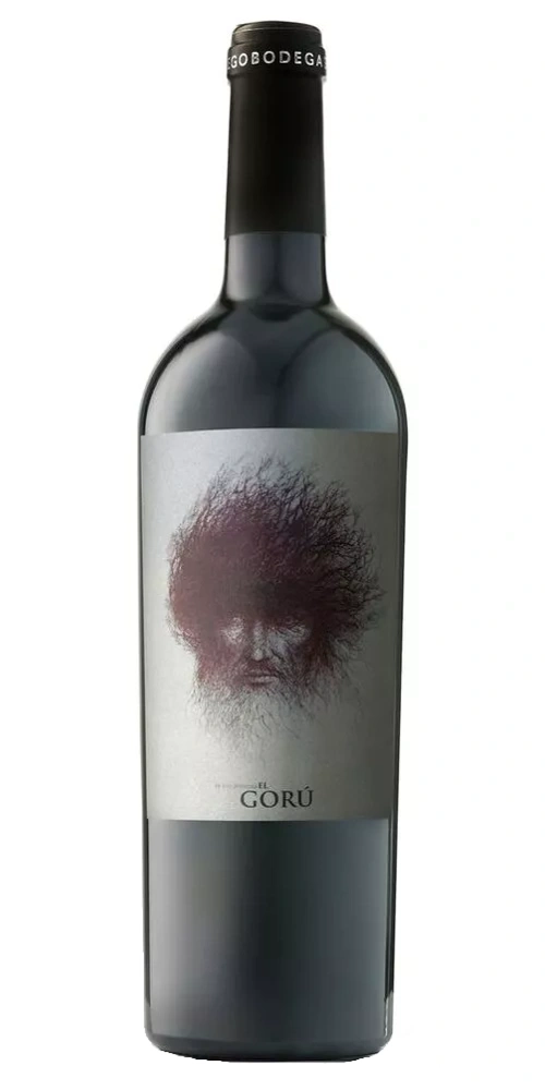Eine Flasche Rotwein mit einem künstlerischen Etikett, das ein Gesicht zeigt.